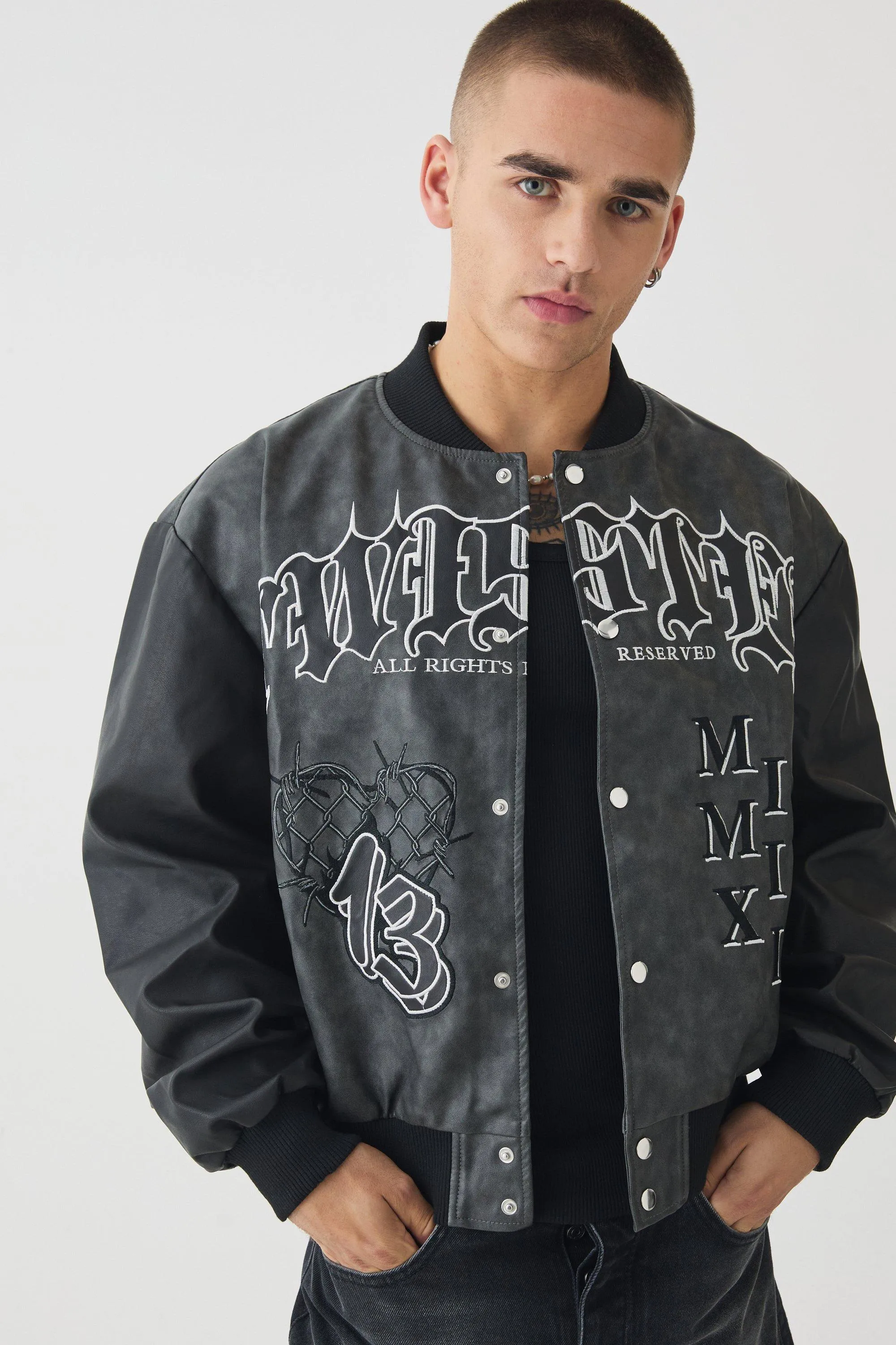 Boxy Tonal Badge Tumbled Pu Varsity Jacket In Black